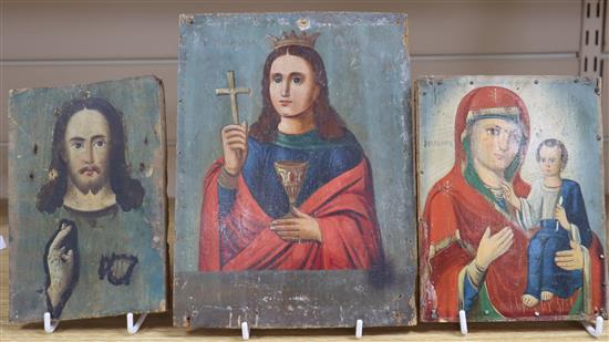 Three Russian painted wood icons, 19th/20th century largest height 23cm
